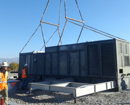 Hvac Unit Being Placed On Roof From Helicopter